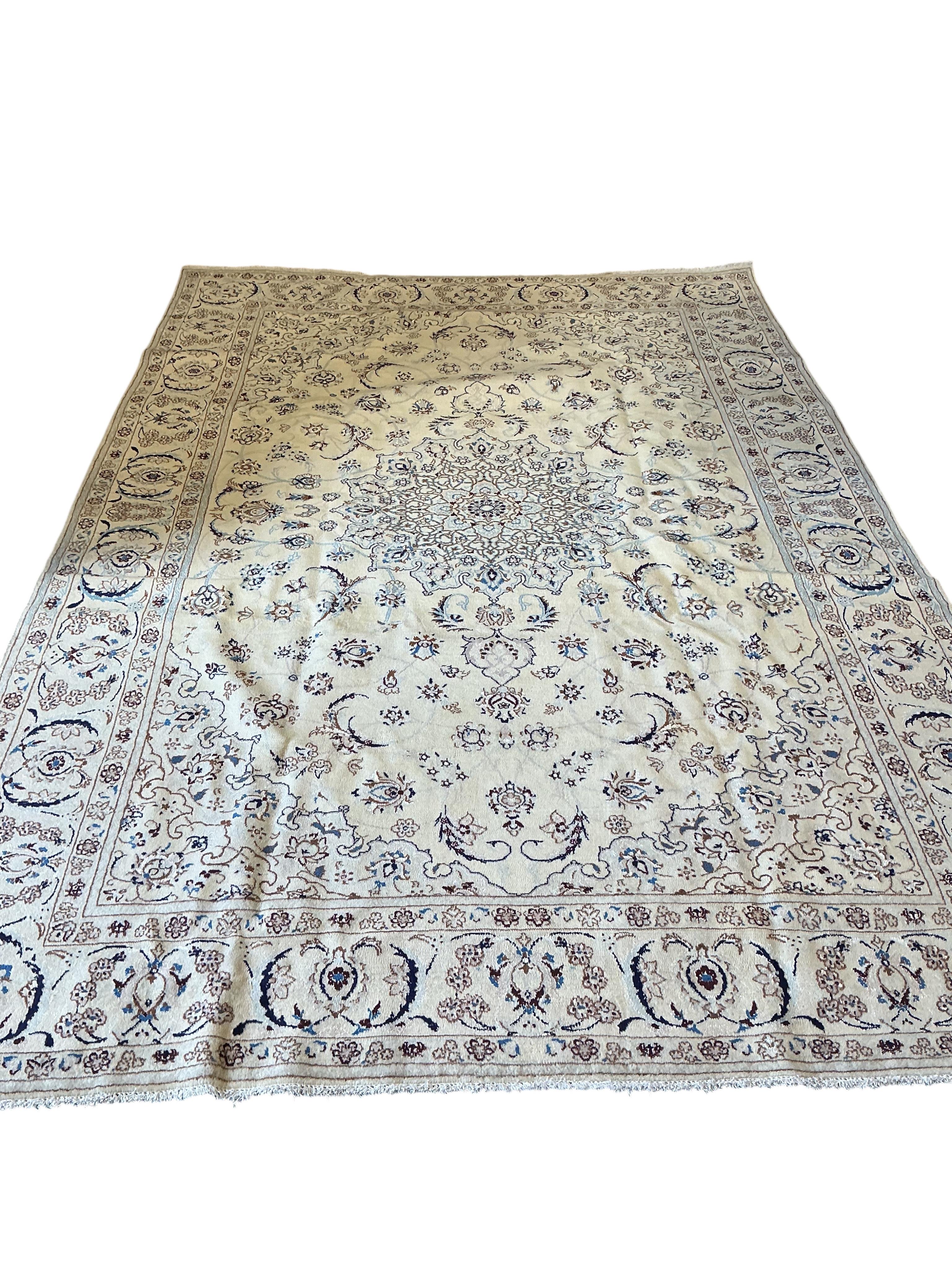 An ivory ground Nain carpet, 300cm x 206cm